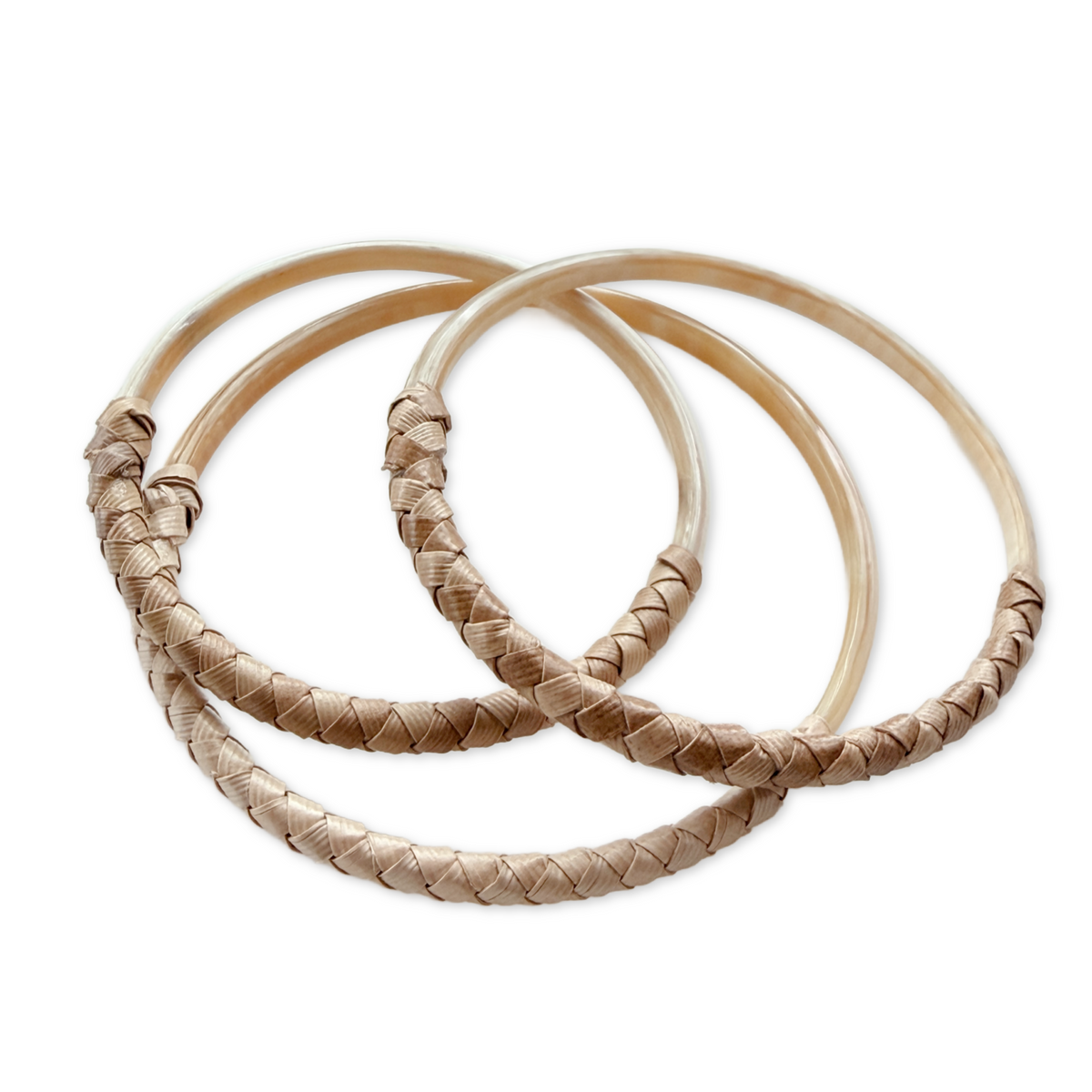 Three woven bangles on a white background