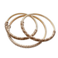 Three woven bangles on a white background