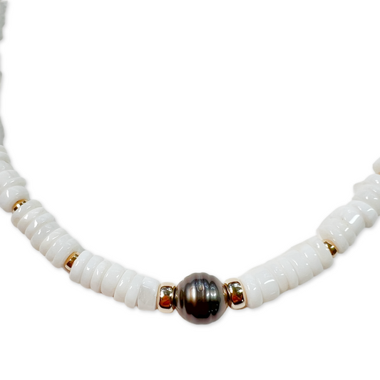 closeup view of a black tahitian pearl with white opal disc choker necklace